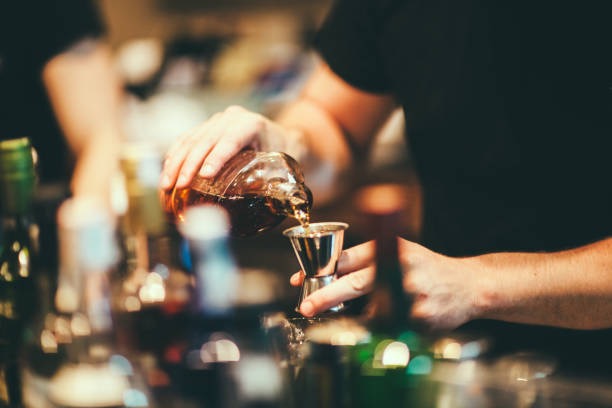 Bartender pouring a craft cocktail